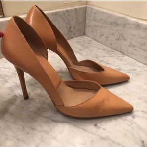 Nude asymmetrical heels.